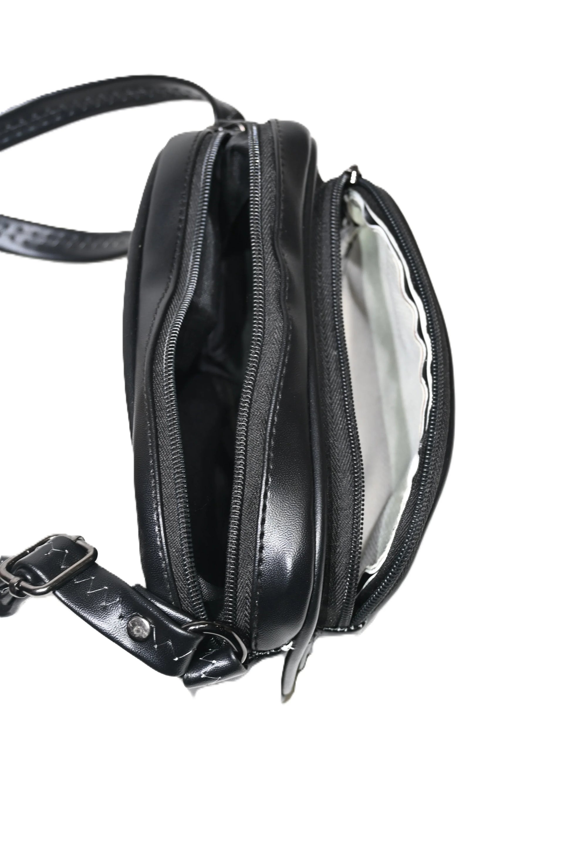 Black leather handbag with dual zip compartments and adjustable strap, shown open