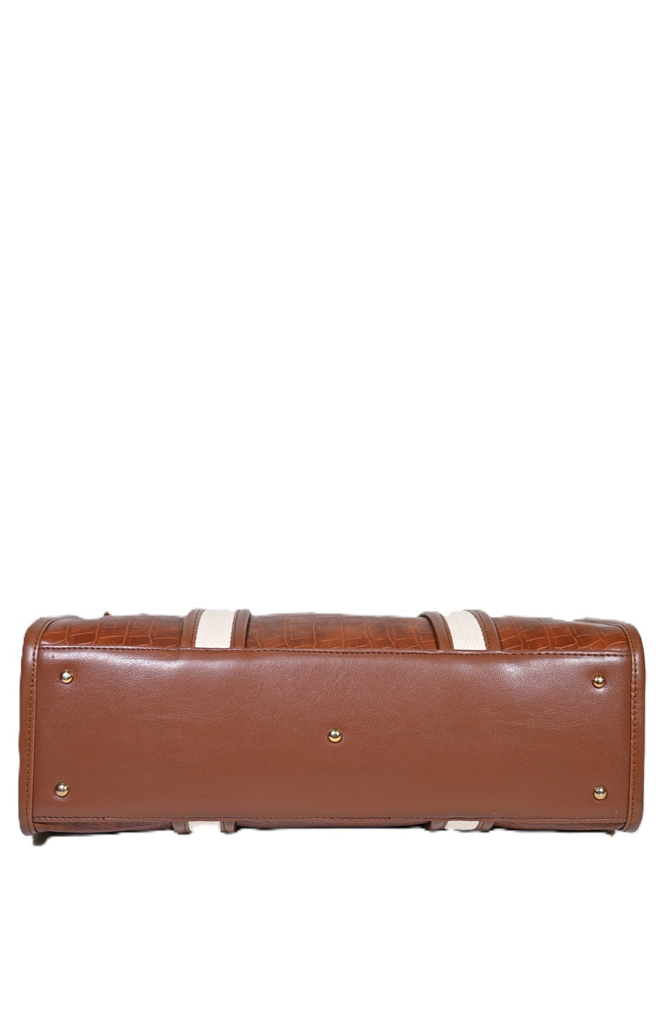 Bottom view of brown leather handbag with gold feet and textured detailing